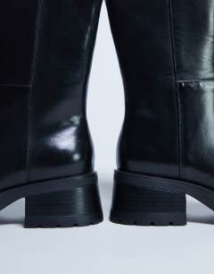 Model wearing Nina chunky heeled ankle boot in black