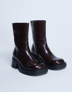 Model wearing Nina chunky heeled ankle boot in chocolate