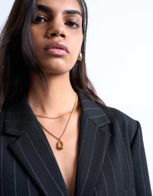 Topshop - Nina - Collier chaîne multi-rangs à pendentif en acier inoxydable résistant à l'eau - Doré