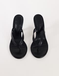 Model wearing Nina toe thong heeled sandal in black