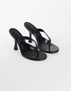 Model wearing Nina toe thong heeled sandal in black