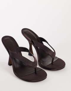Model wearing Nina toe thong heeled sandal in chocolate satin