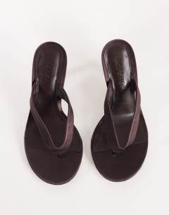 Model wearing Nina toe thong heeled sandal in chocolate satin