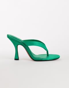 Model wearing Nina toe thong heeled sandal in green satin