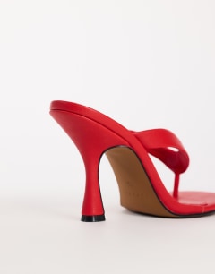 Model wearing Nina toe thong heeled sandal in red