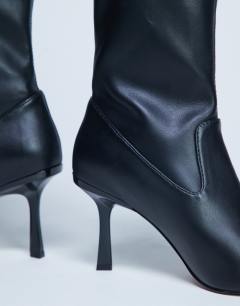 Model wearing Noah point toe boot in black