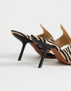 Model wearing Nora real leather with hair angular high heeled mule sandal in zebra