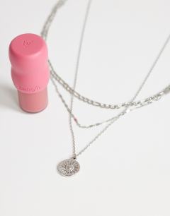 Model wearing Nyle stainless steel multi chain necklace with pendants in silver