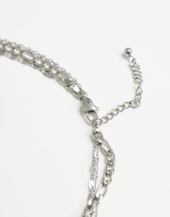 Model wearing Nyle stainless steel multi chain necklace with pendants in silver