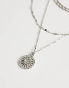 Model wearing Nyle stainless steel multi chain necklace with pendants in silver