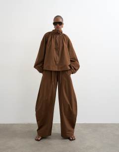 Model wearing Nylon anorak jacket in chocolate