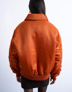 Model wearing Nylon bomber jacket in rust