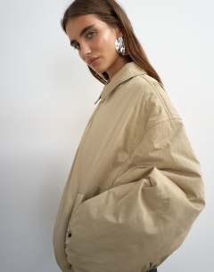 Model wearing Nylon bomber jacket in stone