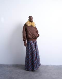 Model wearing Nylon bomber jacket with a faux fur collar in chocolate