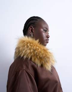 Model wearing Nylon bomber jacket with a faux fur collar in chocolate