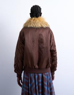 Model wearing Nylon bomber jacket with a faux fur collar in chocolate