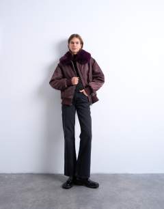 Model wearing Nylon bomber jacket with faux fur collar in red