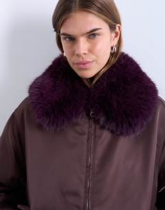 Model wearing Nylon bomber jacket with faux fur collar in red