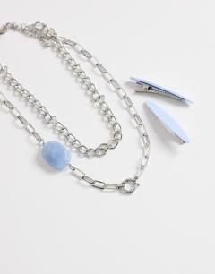 Model wearing Oakley stainless steel multi chain necklace with blue stone in silver