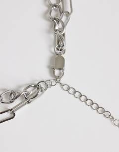 Model wearing Oakley stainless steel multi chain necklace with blue stone in silver