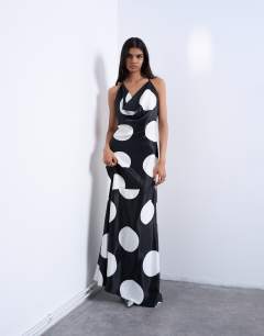 Model wearing Occasion cowl neck dress in mono polka dot print