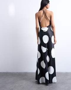 Model wearing Occasion cowl neck dress in mono polka dot print