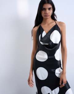 Model wearing Occasion cowl neck dress in mono polka dot print