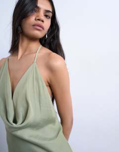 Model wearing Occasion mixed fabric cowl neck dress in soft green