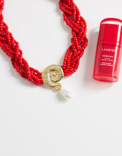 Model wearing Ocean bead necklace with charm in red and gold