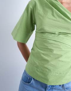 Model wearing Off shoulder drape neck in avocado green