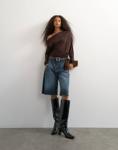 Model wearing Off shoulder long sleeve top in deep mahogany