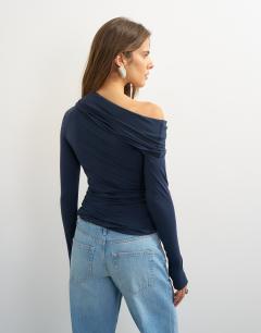 Model wearing Off shoulder ruched long sleeve top in navy