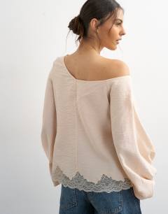 Model wearing Off shoulder tie detail lace trim blouse in ecru