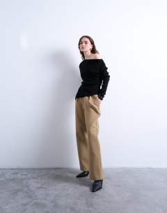 Model wearing Off the shoulder knitted top in black