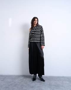 Model wearing Off the shoulder ruched detail long sleeve top in stripe