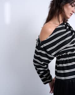 Model wearing Off the shoulder ruched detail long sleeve top in stripe