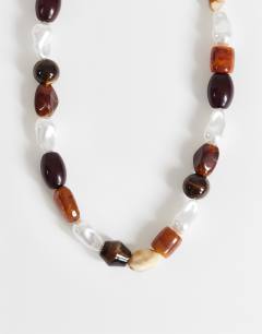 Model wearing Olive bead necklace in brown mix