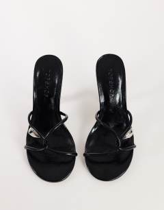 Model wearing Olivia strappy high heel sandal with ball detail in black