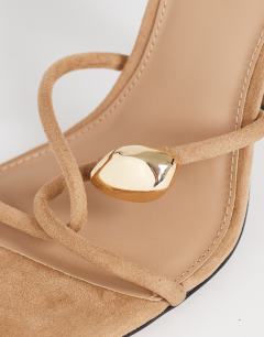 Model wearing Olivia strappy high heel sandal with ball detail in taupe faux suedette