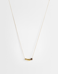 Model wearing Olivio stainless steel necklace in gold with brown bead