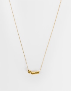 Model wearing Olivio stainless steel necklace in gold