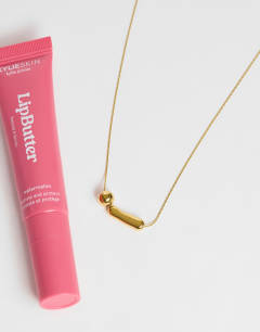 Model wearing Olivio stainless steel necklace in gold