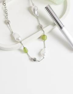 Model wearing Omelia necklace in faux pearl, silver and green