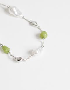 Model wearing Omelia necklace in faux pearl, silver and green