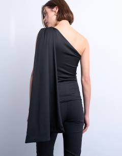 Model wearing One shoulder cape detail top in black