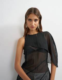 Model wearing One shoulder cape detail tunic in black