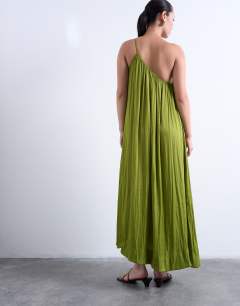 Model wearing One shoulder chuck on liquid satin dress in green