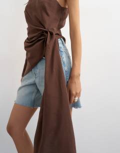 Model wearing One shoulder cinch side draped top in chocolate