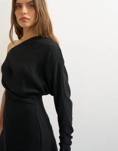 Model wearing One shoulder draped long sleeve asymmetric tunic in black