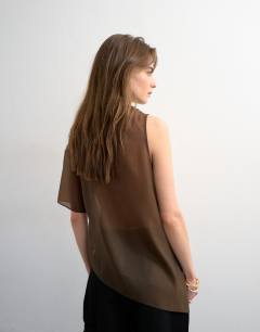 Model wearing One shoulder organza top in chocolate